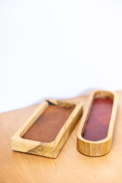 Wooden tray with two compartments on a light wooden surface